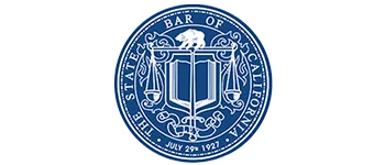 Blue and white circular seal of the State Bar of California, featuring scales, a book, a bear, and the founding date, July 29, 1927.